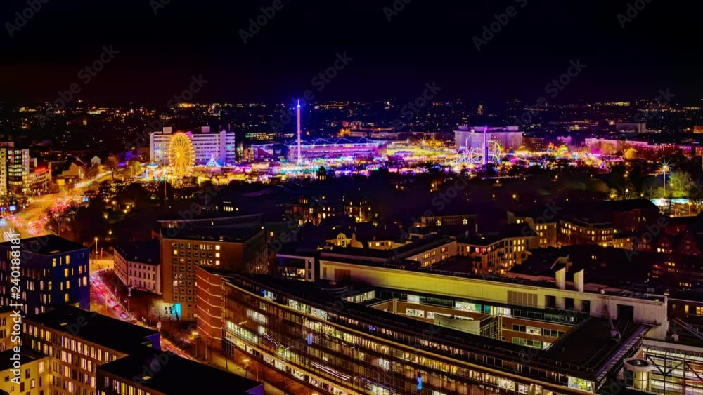 Aerial view of downtown Hamburg, Germany, and the famous funfair (German: Hamburger Dom), illuminated at night. 4k UHD time lapse video. Aerial view of downtown Hamburg, Germany, and the famous funfair (German: Hamburger Dom), illuminated at night. 4k UHD time lapse video.