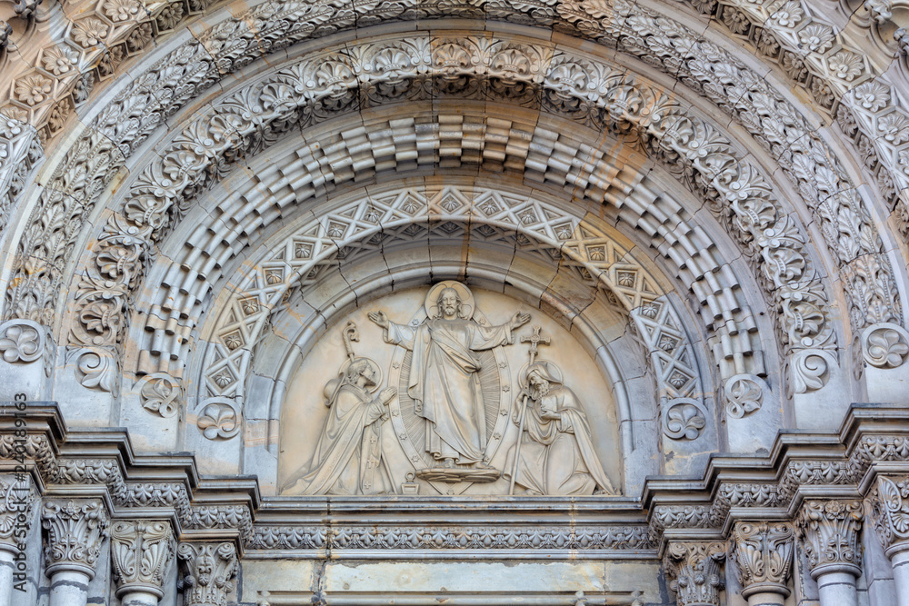 PRAGUE, CZECH REPUBLIC - OCTOBER 17, 2018: The relief of Jesus and st. Cyril and Metodius on the portal of the church kostel Svatého Cyrila Metodeje by Václav Levý (1867 - 1869).