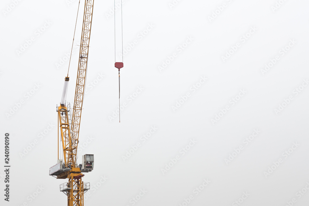 Crane yellow in construction area Crane yellow in construction area