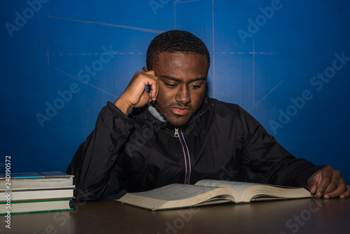 Young black college student studies for test