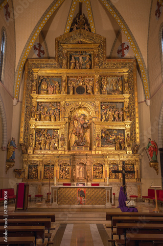 ZARAGOZA, SPAIN - MARCH 3, 2018: The polychome carved renaissance main altar in church Iglesia de San Miguel de los Navarros by Damian Forment (1519).
