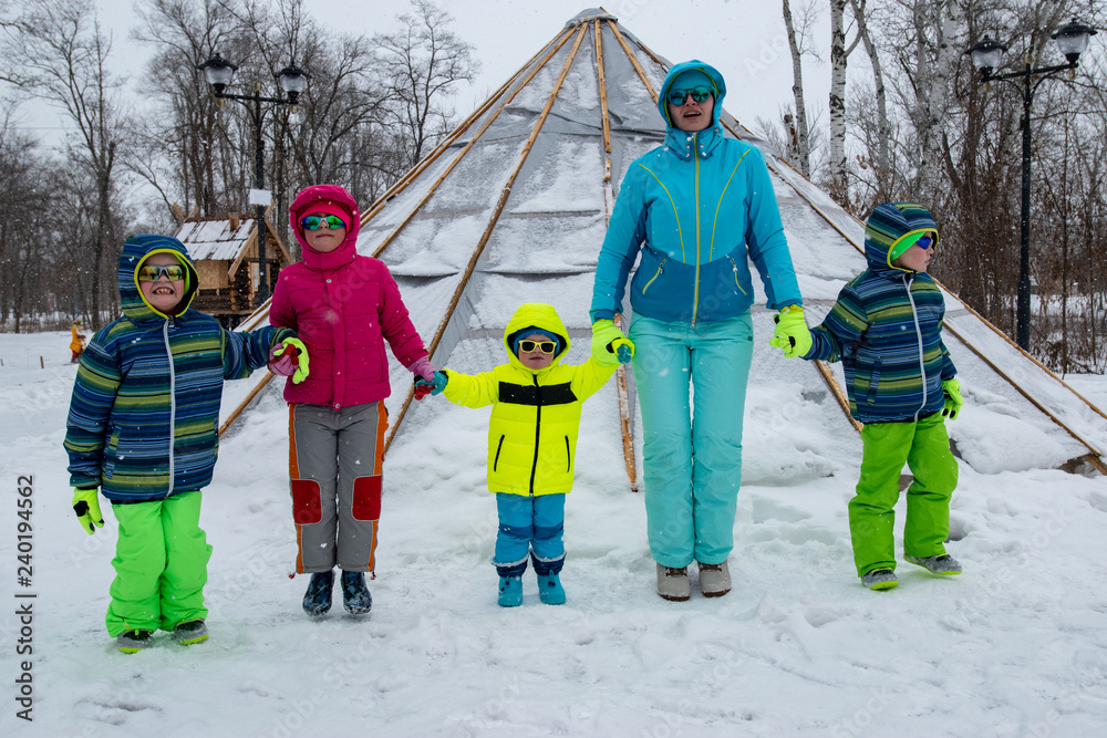blue ski suit wearing sunglasses 