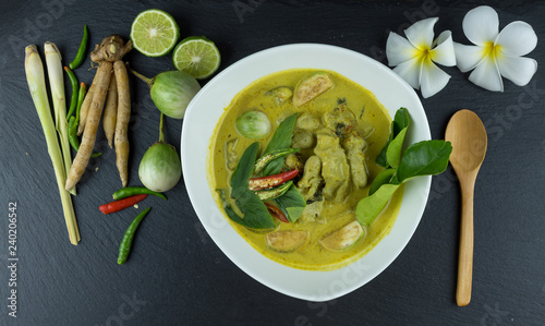 fish ball Green curry with coconut curry  (Kaeng kheiyw hwan) on dark wooden background with Thai tradition food served with steamed rice. Thai food very popular