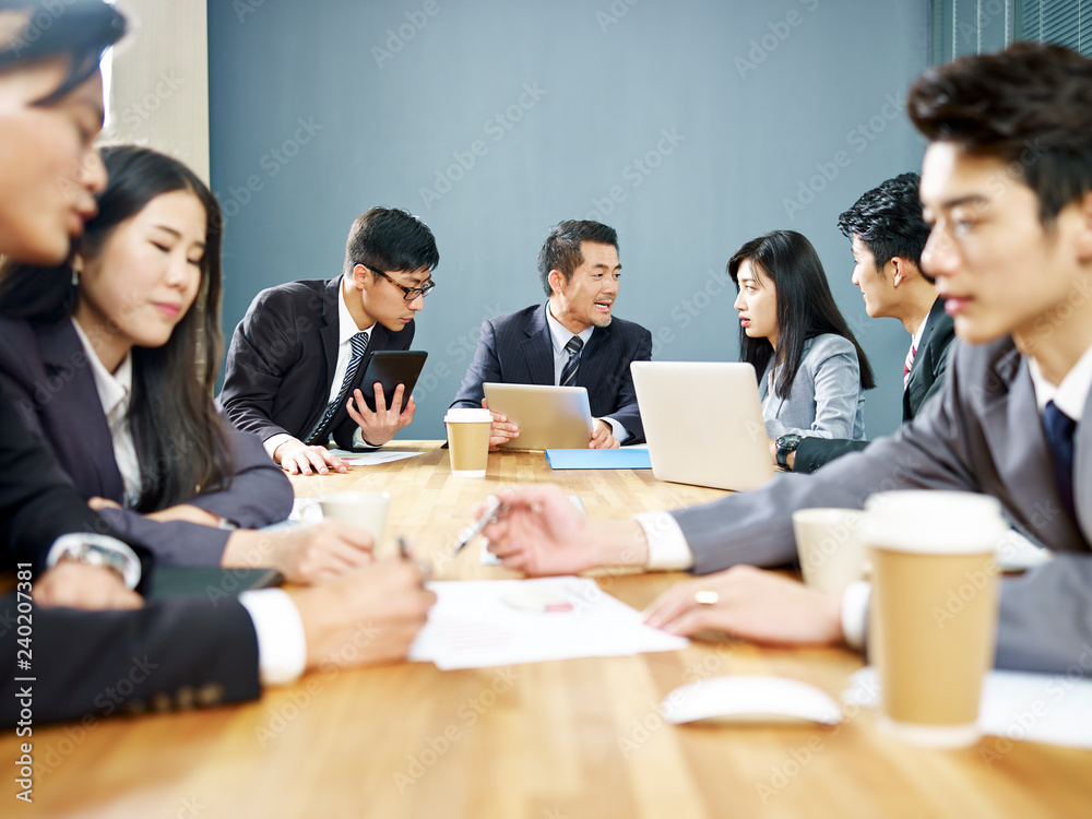 asian corporate people discussing business in meeting