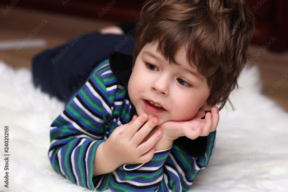 Little twins are lying on the floor