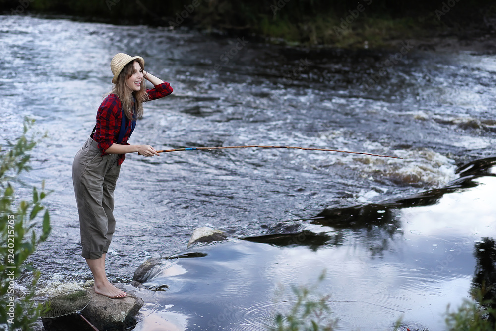 Girl by the river with a fishing rod Girl by the river with a fishing rod