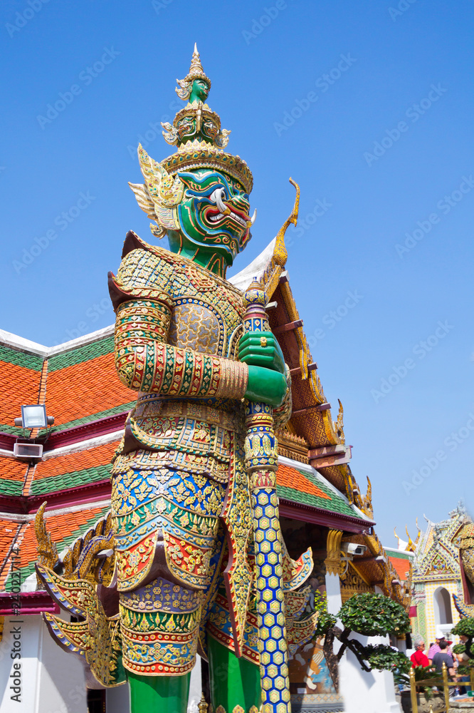 Bangkok, Thailand, temple of the emerald Buddha (Wat Phra Kaeo) in the Royal Palace. At the entrance to Wat Phra Keo are two huge statues-the defenders of the temple from evil spirits, demons Yaksha.