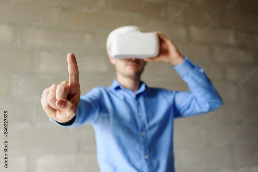 Builder projecting with VR glasses future interior standing at the construction site Builder projecting with VR glasses future interior standing at the construction site