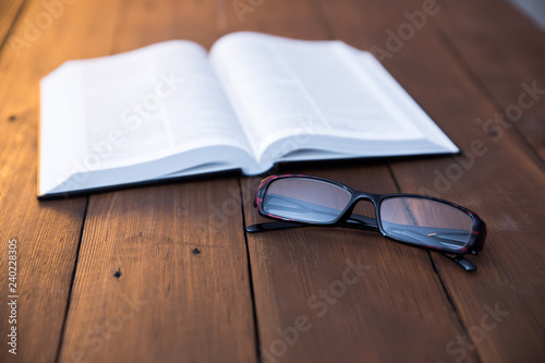 book with glasses