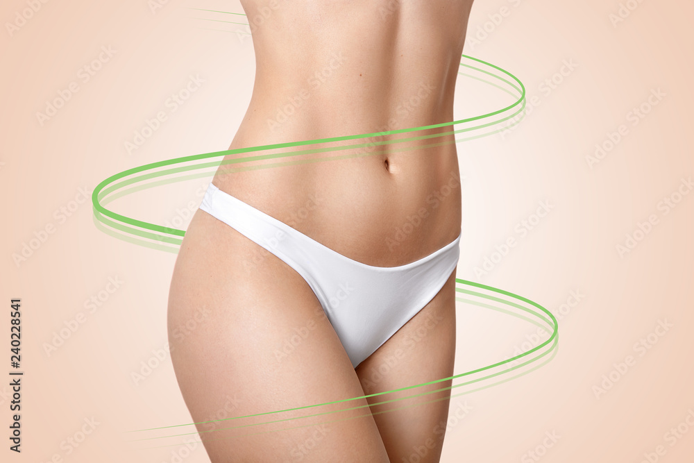 Fotka „Fat lose, health, balance, skin care concept. Torso of young healthy  woman with perfect body shape, has soft skin, cyan arrows across figure,  wears white panties, isolated over beige background“ ze