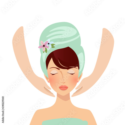 Beautiful relaxing girl in towel having spa face massage