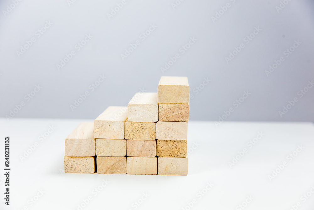 Wooden bricks laid out in the form of a ladder up Wooden bricks laid out in the form of a ladder up