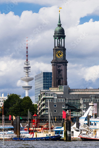 Cityscape of the harbor with the St. Michael's Church (St. Michaelis) and the TV tower (German: Fernsehturm) in Hamburg, Germany. photo