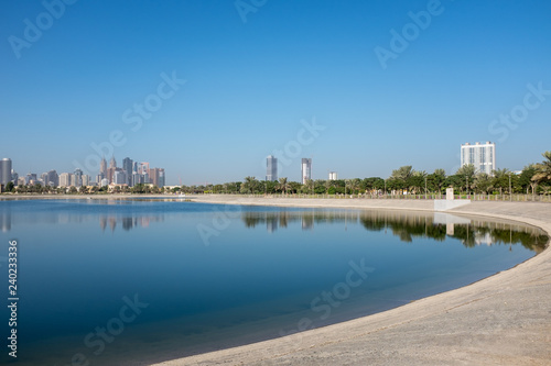 Man-made pond at Al Barsha Pond Park, Dubai, United Arab Emirates