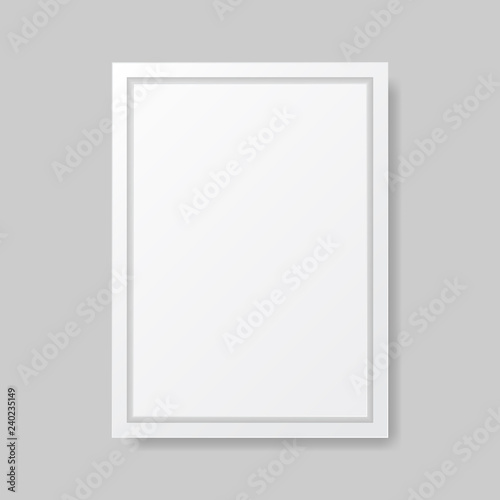 Realistic empty white picture frame, isolated on a neutral gray background. 