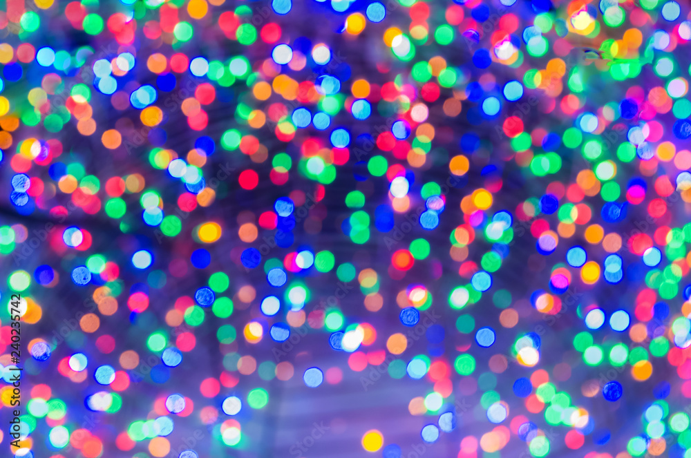 multicolored Christmas lights in defocus; christmas background