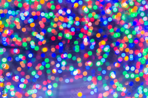 multicolored Christmas lights in defocus; christmas background