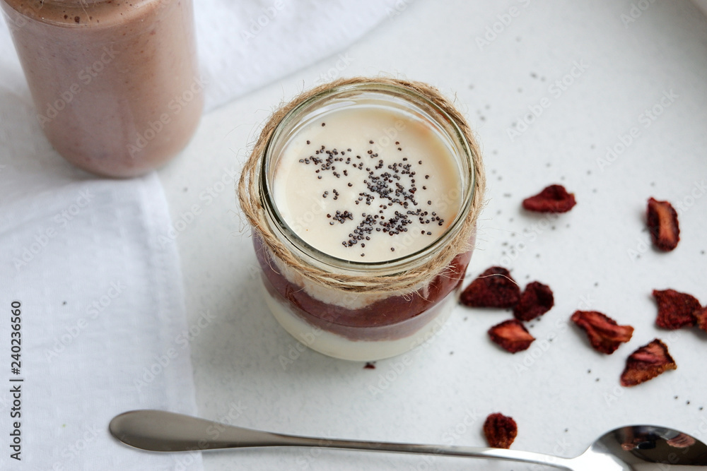 Homemade yogurt with honey, ryazhenka and strawberry jam. View from above Homemade yogurt with honey, ryazhenka and strawberry jam. View from above