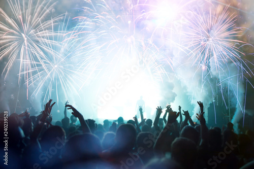 Crowd with Fireworks. New Years Eve concept.