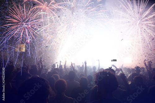 Crowd with Fireworks. New Years Eve concept.
