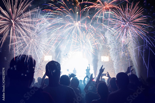 Crowd with Fireworks. New Years Eve concept.