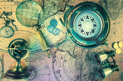 Old Zodiac globe,astrological.Vintage map,old coins.Retro ship lantern,binoculars,sextant.Antique compass.Candlestick,watch and magnifier Travel and marine engraving background. Treasure hood concept.
