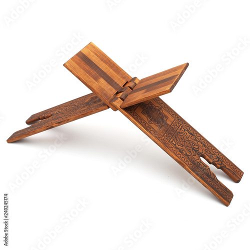 Muslim Holy book Quran rahle, wooden stand isolated on a white background photo