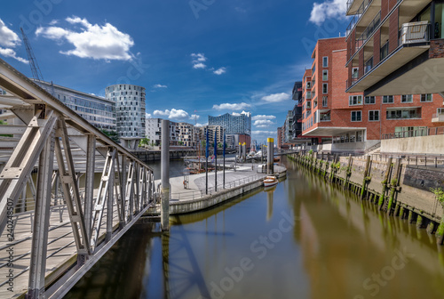The Harbor District (HafenCity) in Hamburg, Germany. A view of the Sandtorkai across on a sunny day.