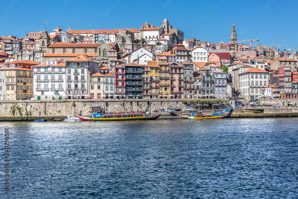 View of river Douro, with Rabelo boats on Ribeira docks, traditional downtown as background