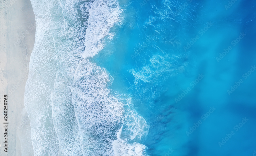 Beach and waves from top view. Turquoise water background from top view. Summer seascape from air. Top view from drone. Travel concept and idea - obrazy, fototapety, plakaty 