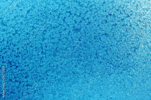 Winter blue background of snowflakes and frost