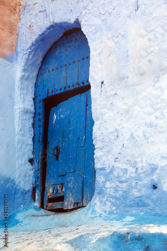 One of the many blue doors of old wood, that we can find in the medina of Chefchaouen, one of the towns most visited by tourists in Morocco © juanorihuela