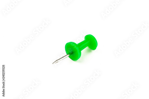 Metal pin, green pin on white background. Isolated.
