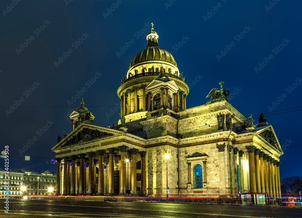 St. Isaac's Cathedral at winter night, tracers from the headlights of cars in foreground ,Saint Petersburg, Russia
