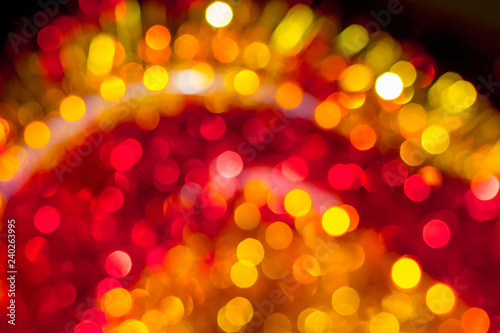 Abstract festive blurry background with bokeh yellow and red colors that glow_