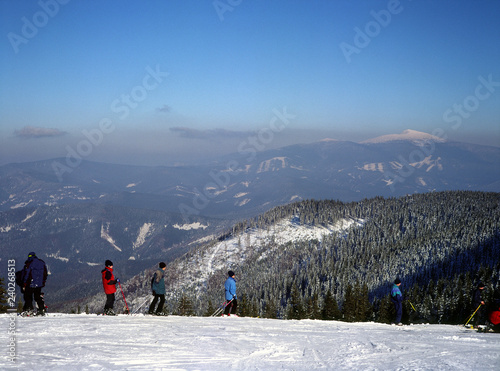 Pilsko Mountain, Korbielow, Beskid ¯ywiecki Mountains, Poland: February, 2011 - ski lift on Pilsko Mountain and Babia Mountain on the horizon photo