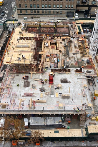 Aerial view of men and materials during the construction of a 42-story high-rise apartment building in midtown Manhattan  New York City.