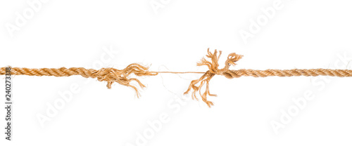 Long frayed rope near to break isolated