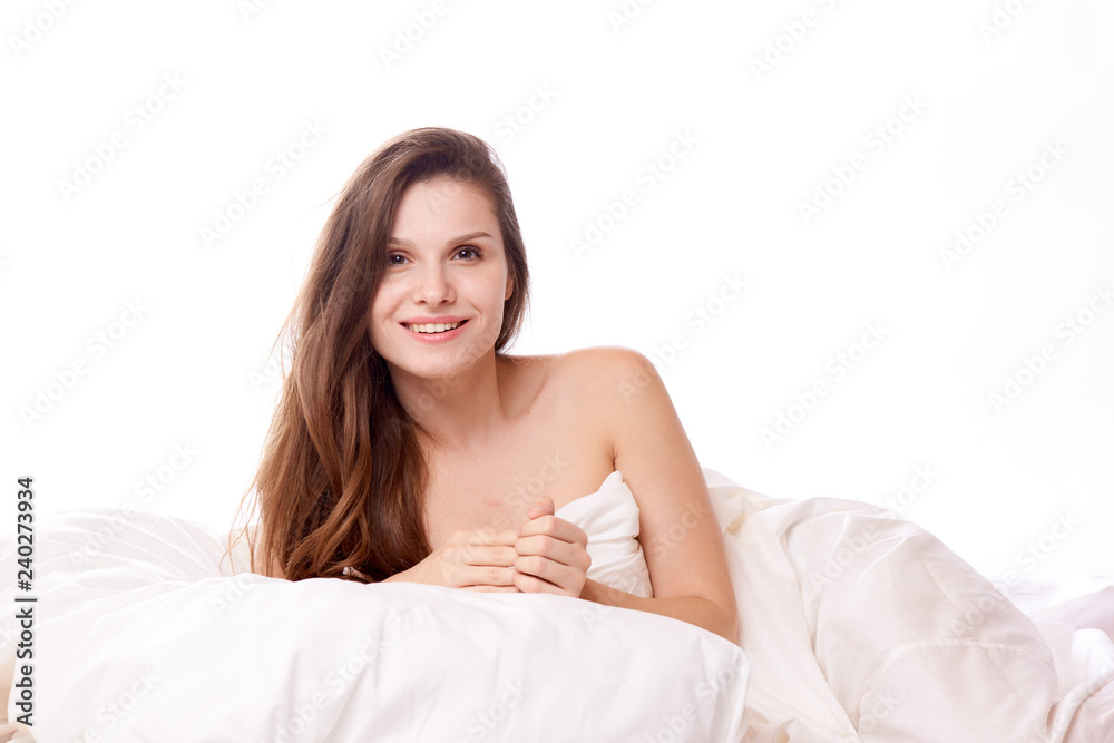 brunette woman lying on bed in bedroom brunette woman lying on bed in bedroom