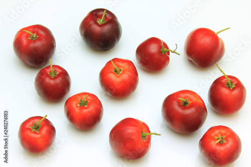 macro, closeup of fresh organic Acerola group, isolated on white background with clipping path