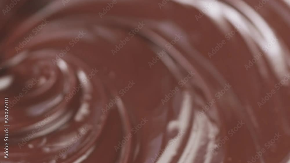 Slow motion mix milk chocolate with whisk Slow motion mix milk chocolate with whisk