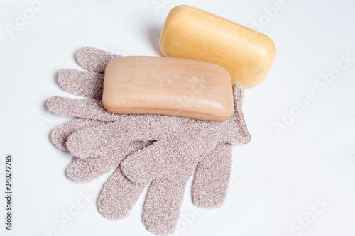 high-grade natural aroma soaps with washing mitten at wite background photo