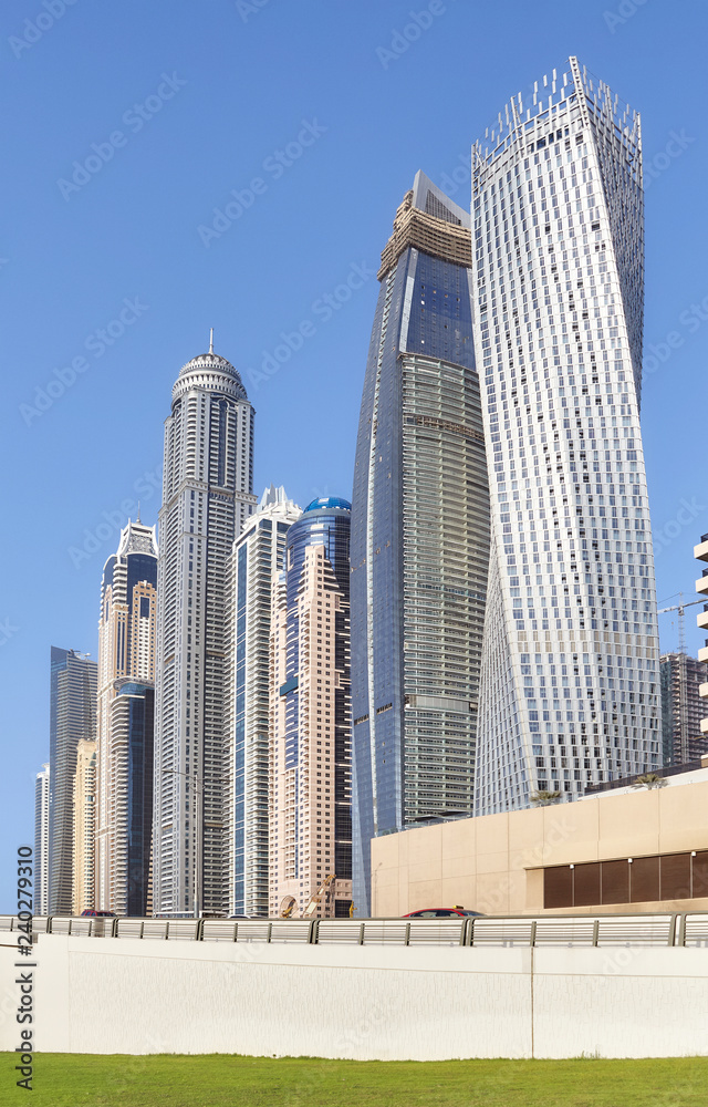 Dubai modern skyscrapers against the blue sky, United Arab Emirates. Dubai modern skyscrapers against the blue sky, United Arab Emirates.