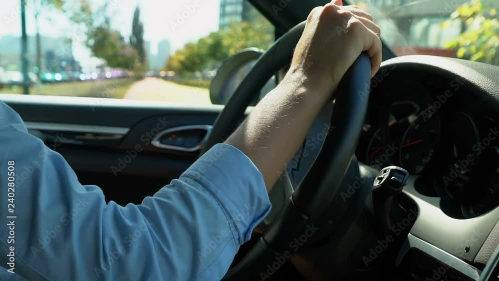 Woman driving car in reverse gear attentive driver looking for free parking spot Woman driving car in reverse gear attentive driver looking for free parking spot