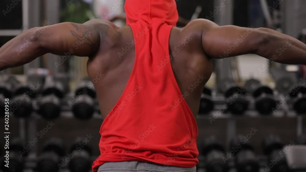 African american man making exercice on training apparatus in gym
