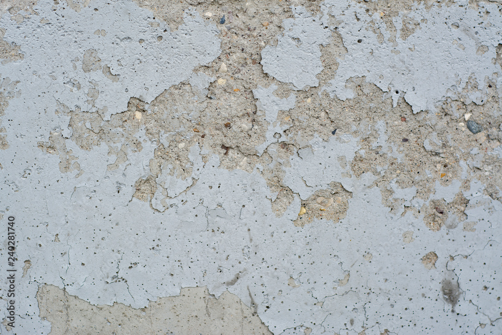 Stone wall with peeling paint