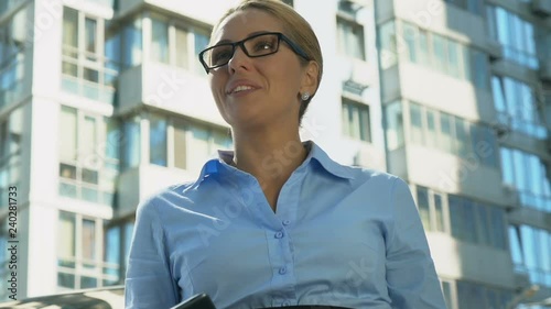 Wallpaper Mural Blond businesswoman showing yes gesture after reading good-news message on phone Torontodigital.ca