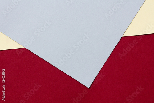 Colored cardboards background in blue, red and yellow. Copy space.
