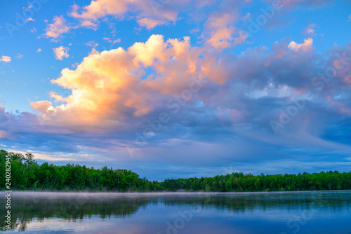 Beautiful reflection trees blue lake waters 
