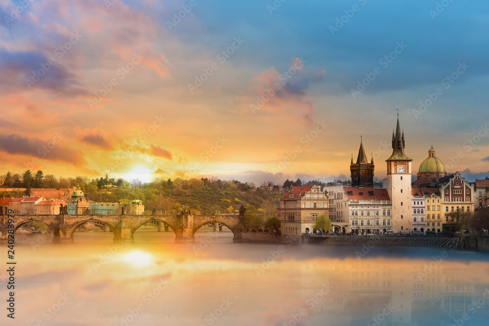 Scenic summer view of the Old Town buildings, Charles bridge and Vltava river in Prague during amazing sunset, Czech Republic